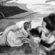 Illustration for article titled Here's a Lady Taking Her Cat for a Swim